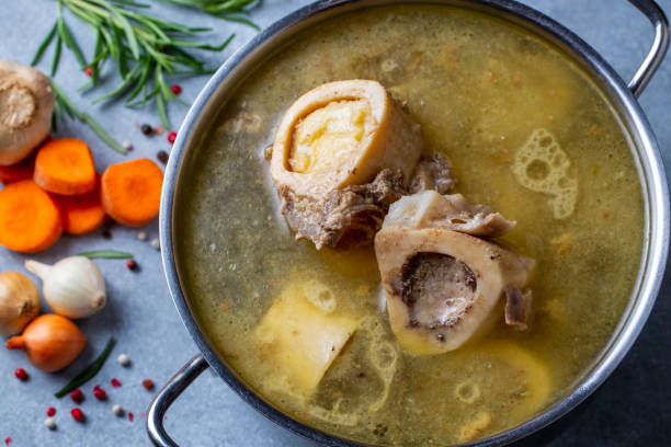 istock Boiled bone and broth. Homemade beef bone broth is cooked in a pot on. Bones contain collagen, which provides the body with amino acids, which are the building blocks of proteins. 1452049469