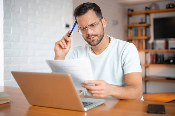 istock Portrait of a successful man at cozy home office 1452049849