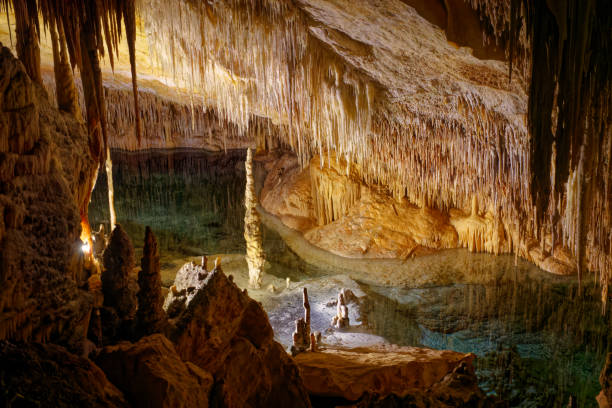 istock Flowstone cave Cuevas Drach (Cuevas Coves) at Mallorca Island, Spain, with stalactites at ceiling and stalagmite on the floor on an autumn day. 1452052348