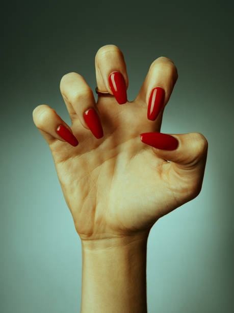 female hand with a beautiful manicure in a semi-compressed state close-up
