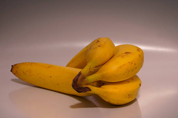 istock Four yellow bananas ready to be eaten 1452060840