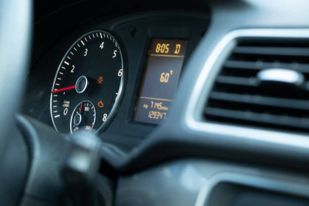 istock speedometer and steering wheel in auto close up 1452069071