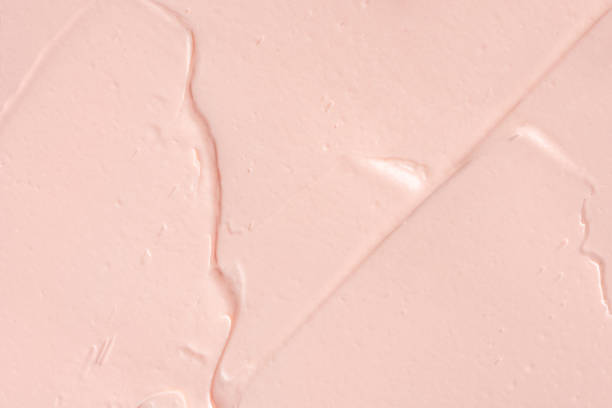 istock Pink cosmetic clay smudge background. Pink creamy cosmetic texture. 1452071759