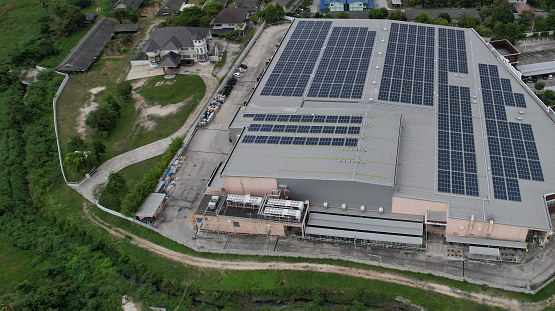 Solar panel install on roof of factory, Green and reusable energy concept