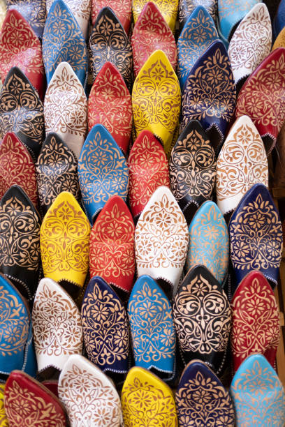 Ornate leather babouches displayed in a craft store. The babouche is a type of traditional footwear in Morocco. stock photo