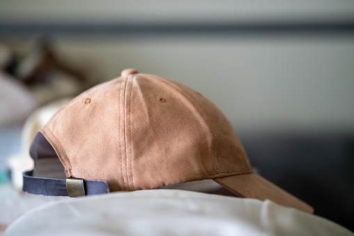 brown baseball cap