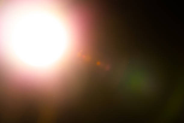 istock Warm lens flares overlay on black background. Spherical Optical Light leak. 1452081411