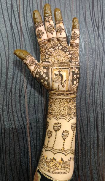 istock Henna painting, Mehendi on women's hands 1452085168