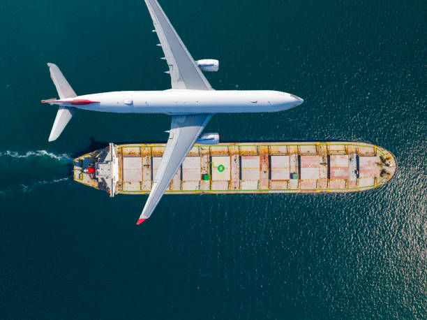 istock Container ship sail through airplane flying on the sea 1452108748