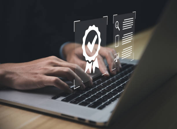 istock Businessman using a laptop and showing check mark. Best Quality Assurance Service Industry-leading ISO certification 1452123109