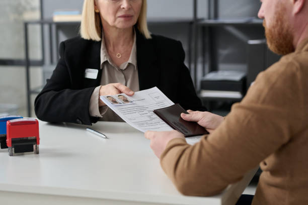 istock Close up of woman handing application form 1452132505