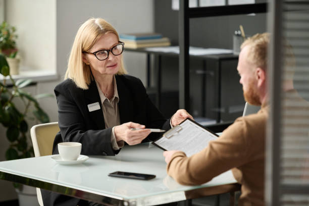 istock Female social worker consulting person 1452132527