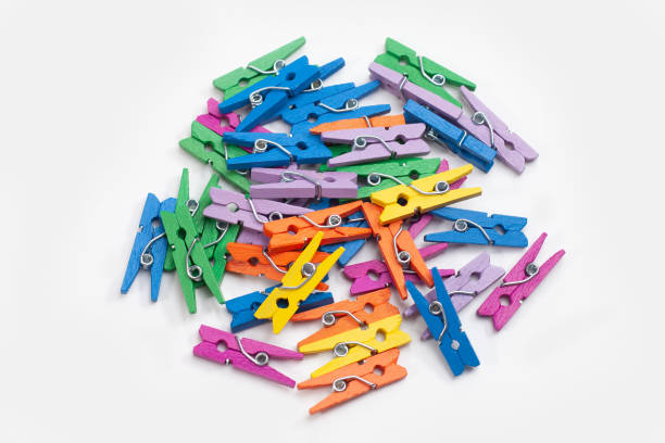 istock many colorful clothes pegs isolated on white background 1452134768