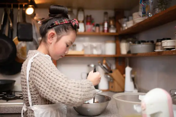 Photo of Girl making sweets at home