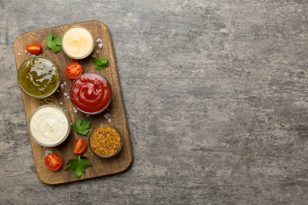 istock Many different sauces and herbs on table, flat lay top view. sauces on plate, healthy concept 1452137155