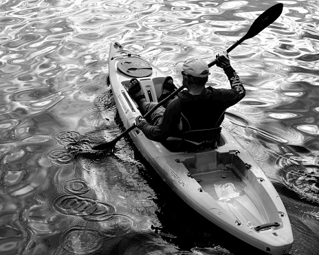 Melbourne, Florida, USA, on the Indian River (Nov. 28, 2022);  The image was made off a pier in the Indian River in Rotary Park in Melbourne, Florida, on Florida's Space Coast.  Kayaking is a popular pastime in this region, and I snapped the image of this kayaker during the early afternoon.