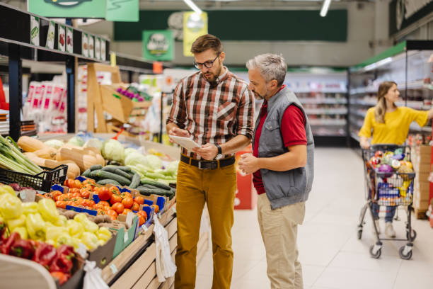 istock Grocery Store Manager Training New Male Employee 1452145831
