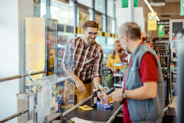 istock Man making Check Out with Cash Desk 1452145910