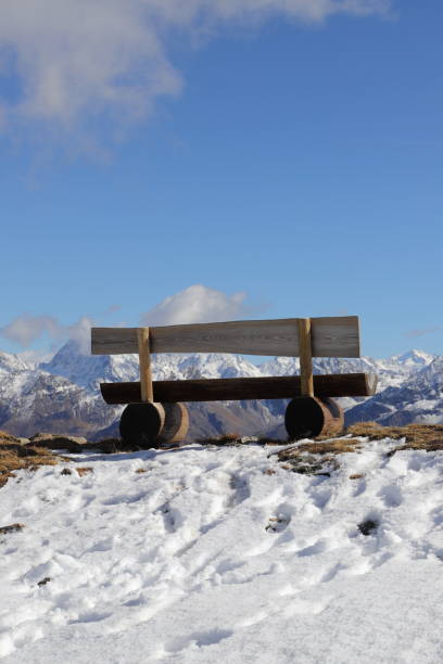 istock an empty bench in the snow on the mountain in tyrol 1452145926