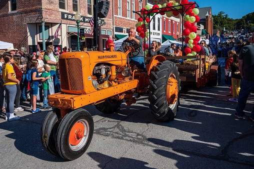 Weston, United States – October 01, 2022: A Vintage tractor in small town Applefest parade