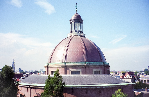 Amsterdam, Netherlands - 1984: A vintage 1980's Nikon negative film scan of the domed De Koepelkerk event space attached to the Renaissance Amsterdam Hotel in the city center of Amsterdam, Netherland.