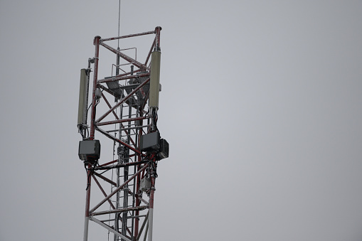 5 G signal tower of cellular communication. Telecommunication tower mounted in the field