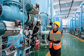 istock A female engineer works in a chemical plant using a laptop computer 1452166359