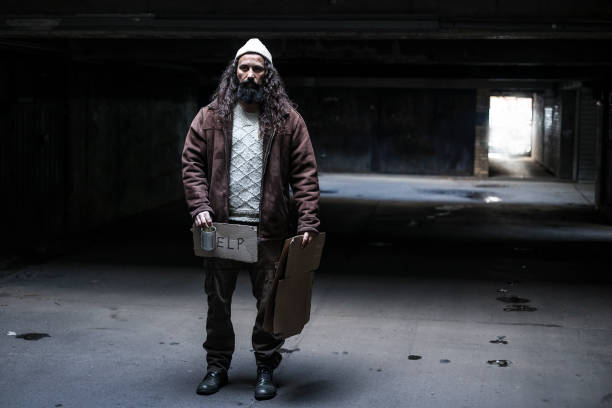 Homeless man on begging on the street. About 45 years old, Caucasian male.
