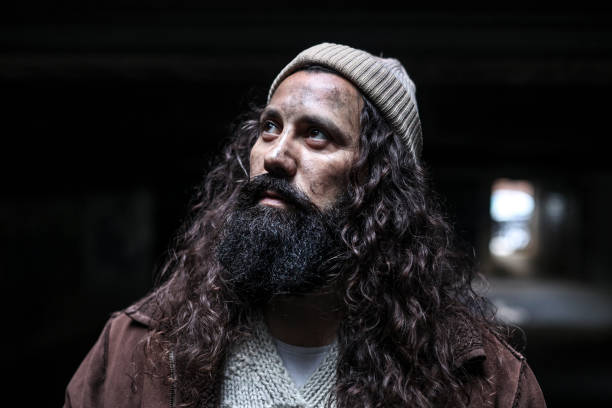 Homeless man on begging on the street. About 45 years old, Caucasian male.