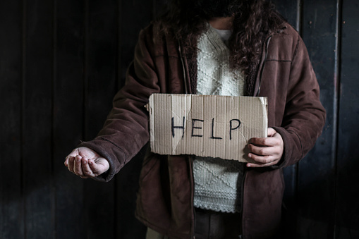 Homeless man on begging on the street. About 45 years old, Caucasian male.