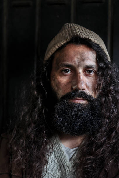Homeless man on begging on the street. About 45 years old, Caucasian male.