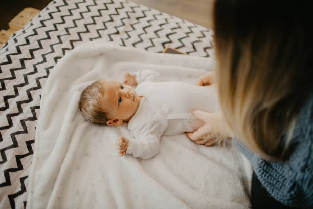 istock High-angle view of a newborn baby boy getting diaper changed 1452172881