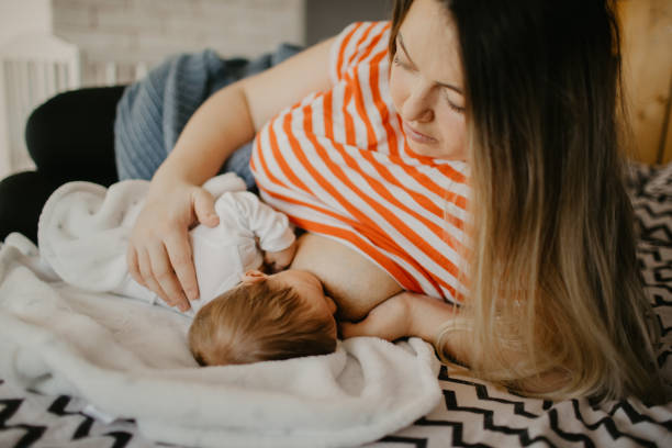 istock Mother nursing her infant 1452172900