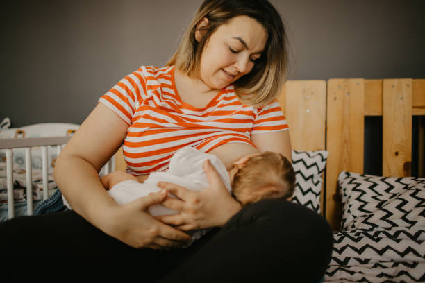 istock Front view of a mother breastfeeding her baby boy 1452172906