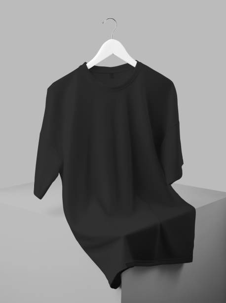 istock Oversized black t-shirt mockup on wooden hanger, isolated on cube background, apparel front view. 1452181655