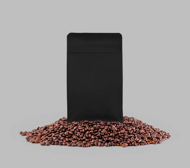 istock Black gusset packaging mockup on coffee beans, isolated on background, close up. 1452181804