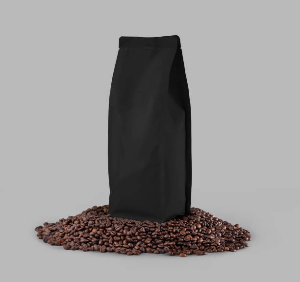istock Black packaging mockup on coffee beans, isolated on background, close up. 1452182072
