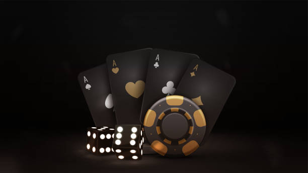 istock Black and gold playing cards, dice and black casino chips in dark scene 1452194893