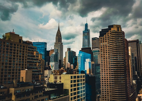 New York City, United States – December 22, 2022: A scenic view of the Chrysler Building and Summit One Vanderbilt in NYC under the fluffy cloudy sky