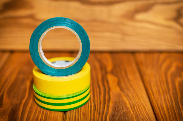 istock Three insulating tape for electrician on wooden boards 1452203009