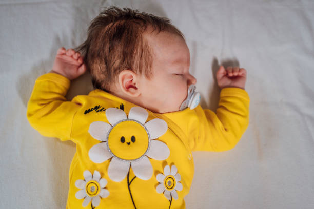 istock Baby girl sleeping at home 1452205307