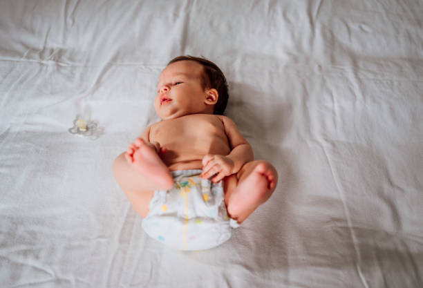 istock Cute baby lying on bed at home 1452205975