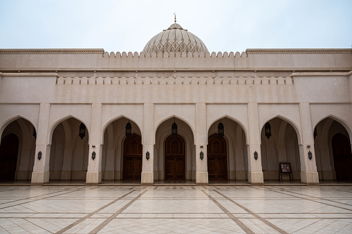Arches surrounding the courtyard of the Sultan Qaboos mosque in Salalah, Oman