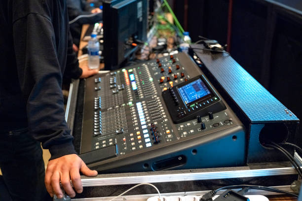 Online broadcast of the event.Video switcher of Television Broadcast with blurry background, working with video and audio mixer, control broadcasts in recording studio