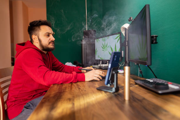 istock Young freelancer having medical problems and smoking weed 1452219031