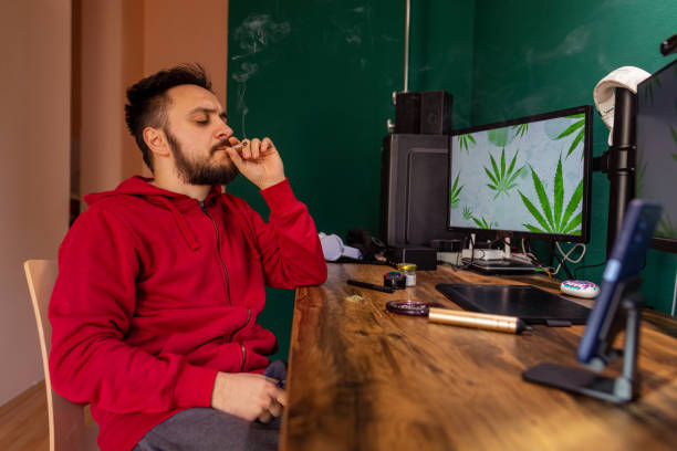 istock A young man smokes a cannabis joint 1452219638