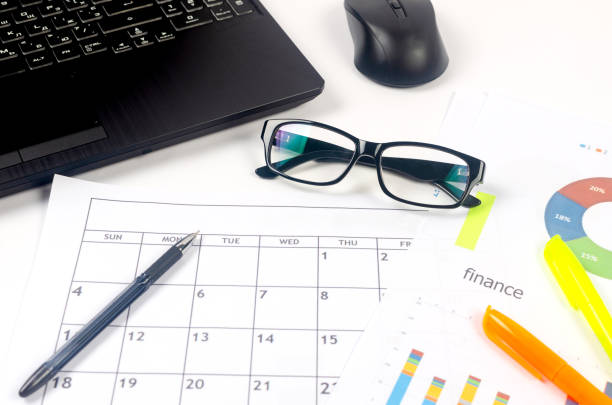 istock Working set for analyzing statistics and results of last year. Charts and graph with financial data, laptop, glasses. 1452224676