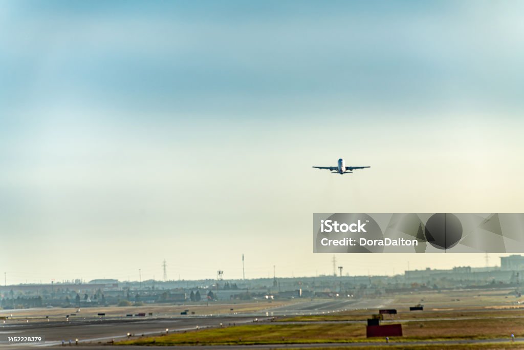 Airplane taking off on runway in Pearson International airport at dusk, Toronto,Canada Toronto,Canada. Airport Tarmac Stock Photo