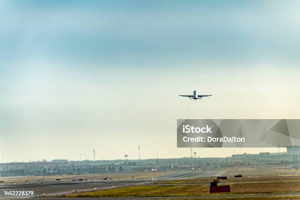 Airplane Taking Off On Runway In Pearson International Airport At Dusk Toronto Canada Stock Photo - Download Image Now