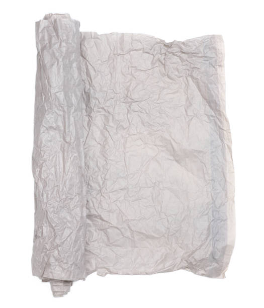 istock Roll of gray crumpled paper isolated on white background 1452230873